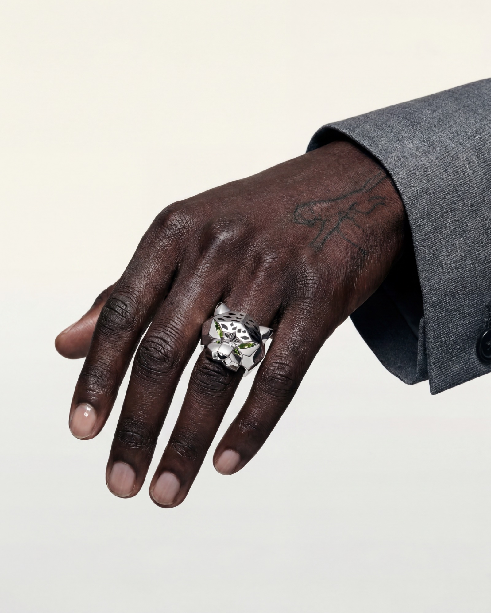 A hand emerging from a grey flannel cuff