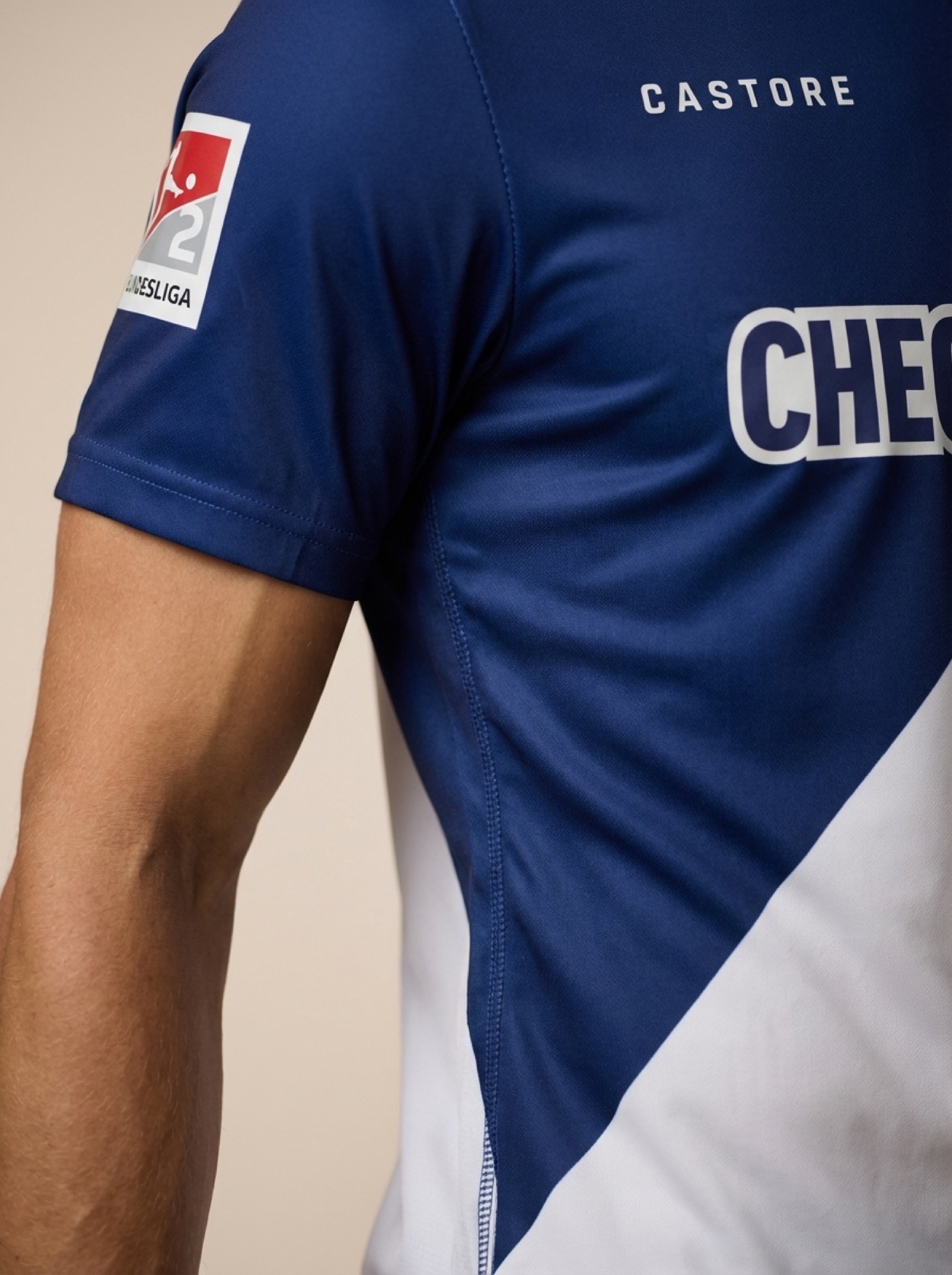 Sleeve detail showing the Bundesliga 2 patch and sponsor lettering