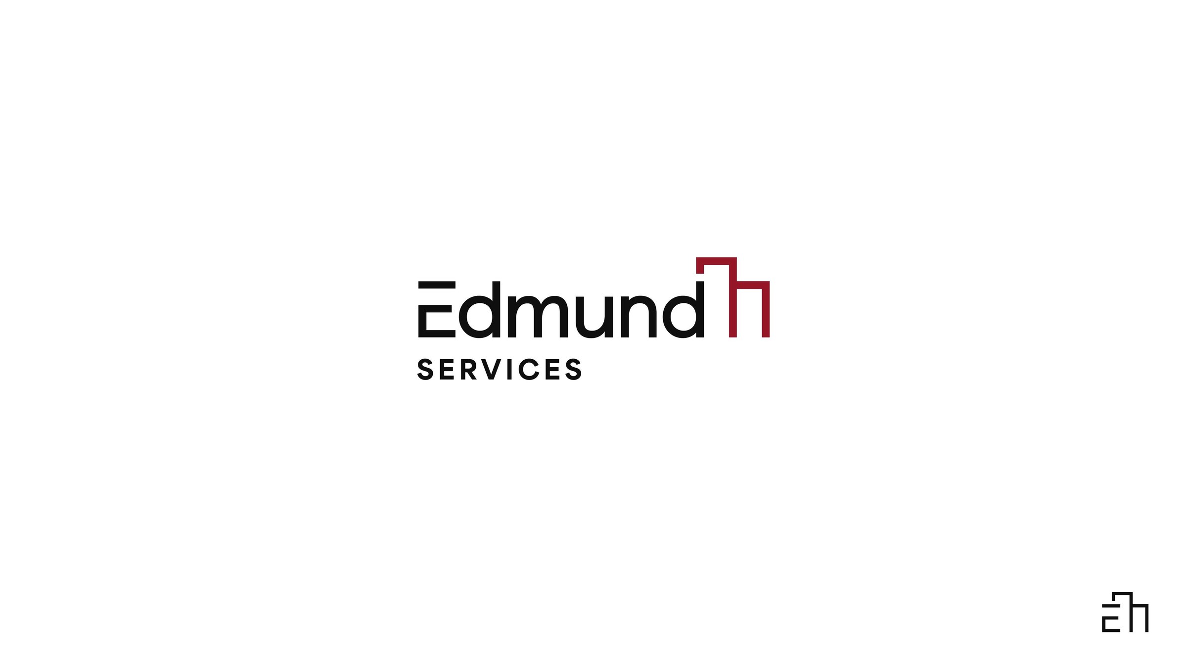 The Edmund Services wordmark and building monogram
