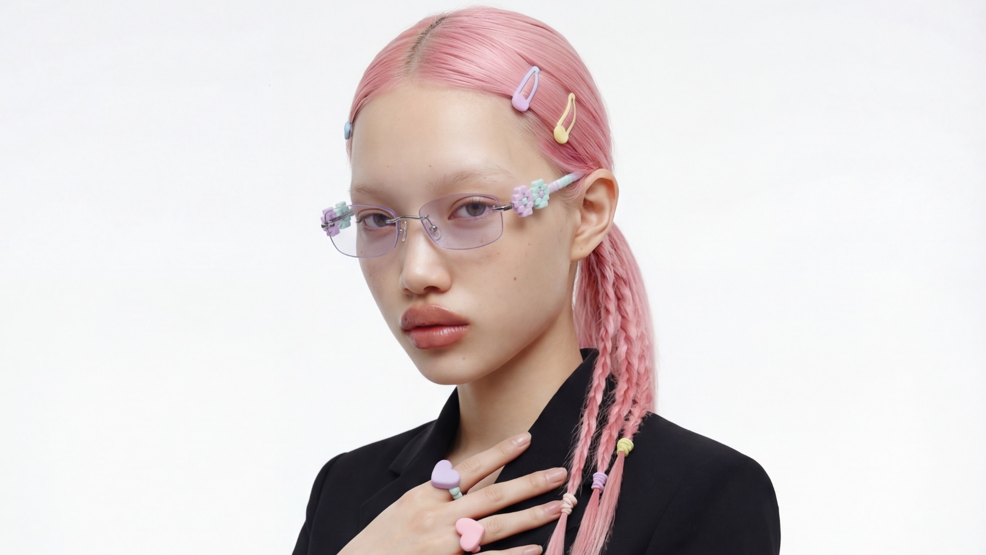 Digital Romance campaign frame: model in black tailoring with pastel braids and the pixel-set floral temples