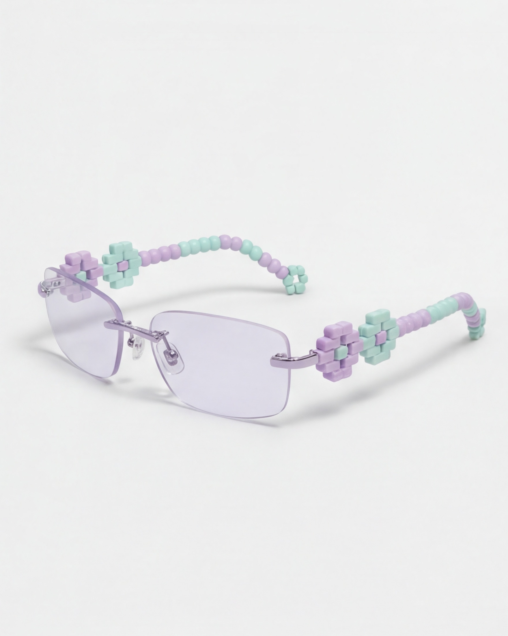 Digital Romance frame, rimless lilac lenses with pixel-set floral temples in lilac and mint