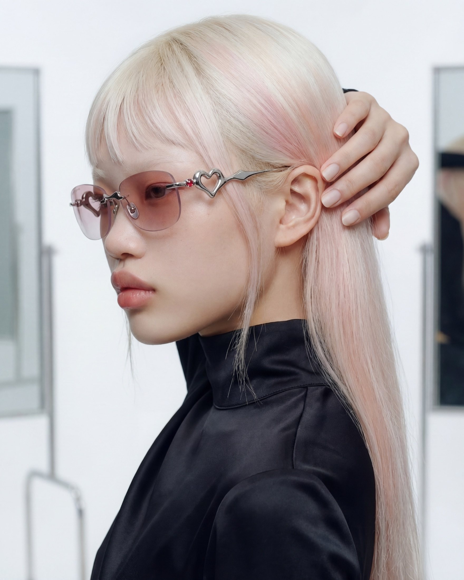 Liquid Heart campaign portrait, model in profile wearing the rose-gradient frame