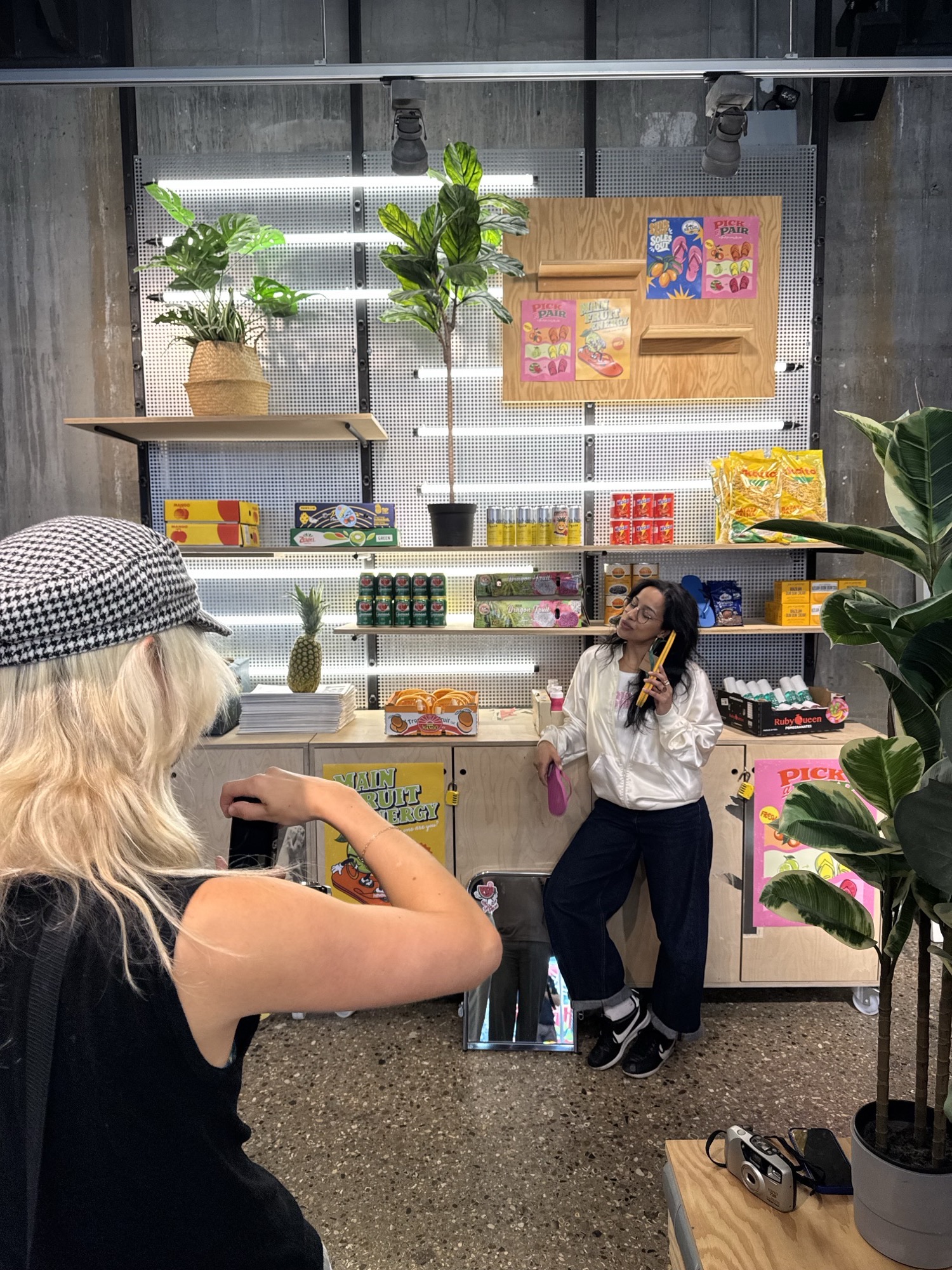 The activation mid-install, team dressing the shelves