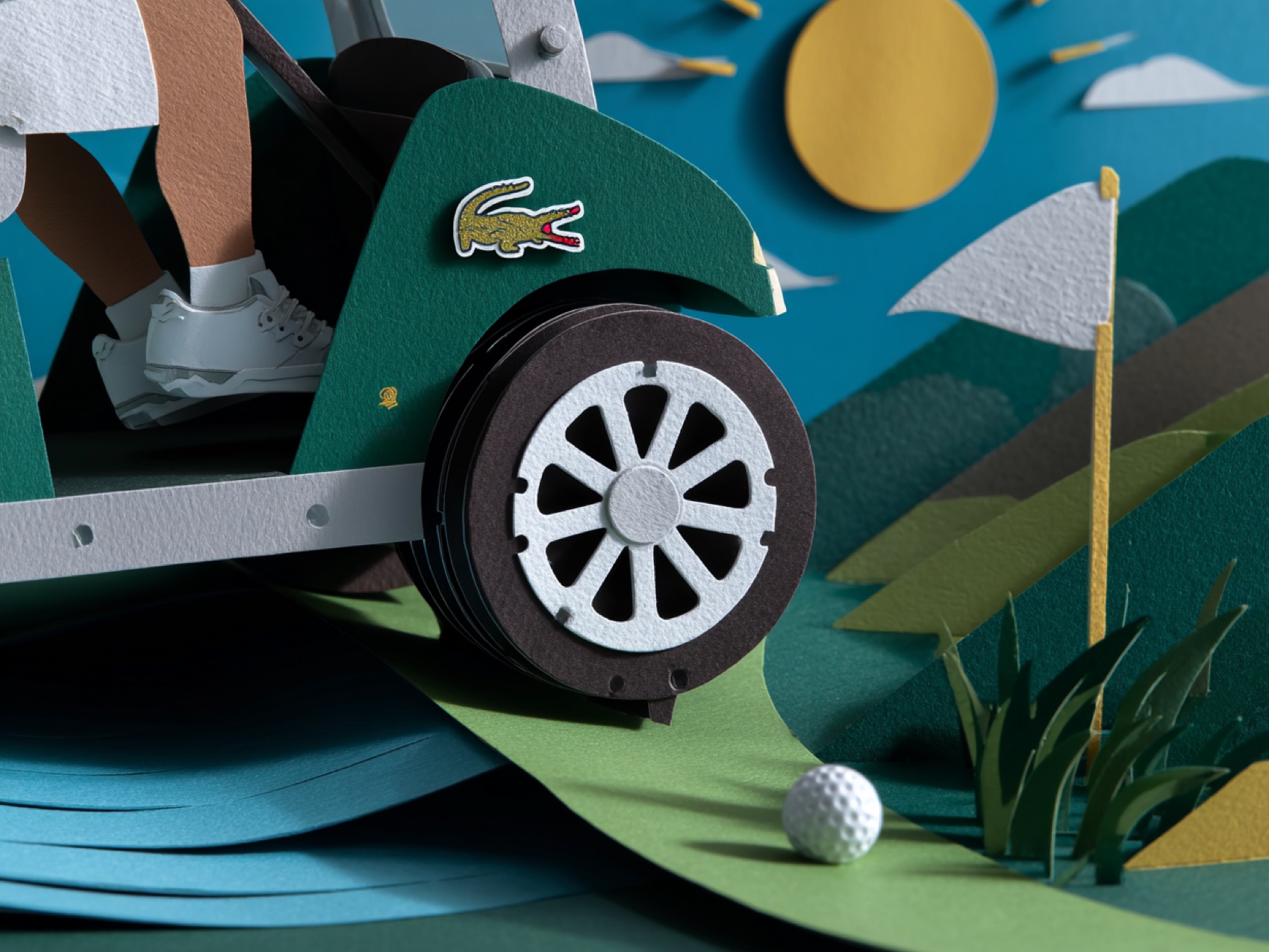 Low angle on the paper cart wheel, flag beyond