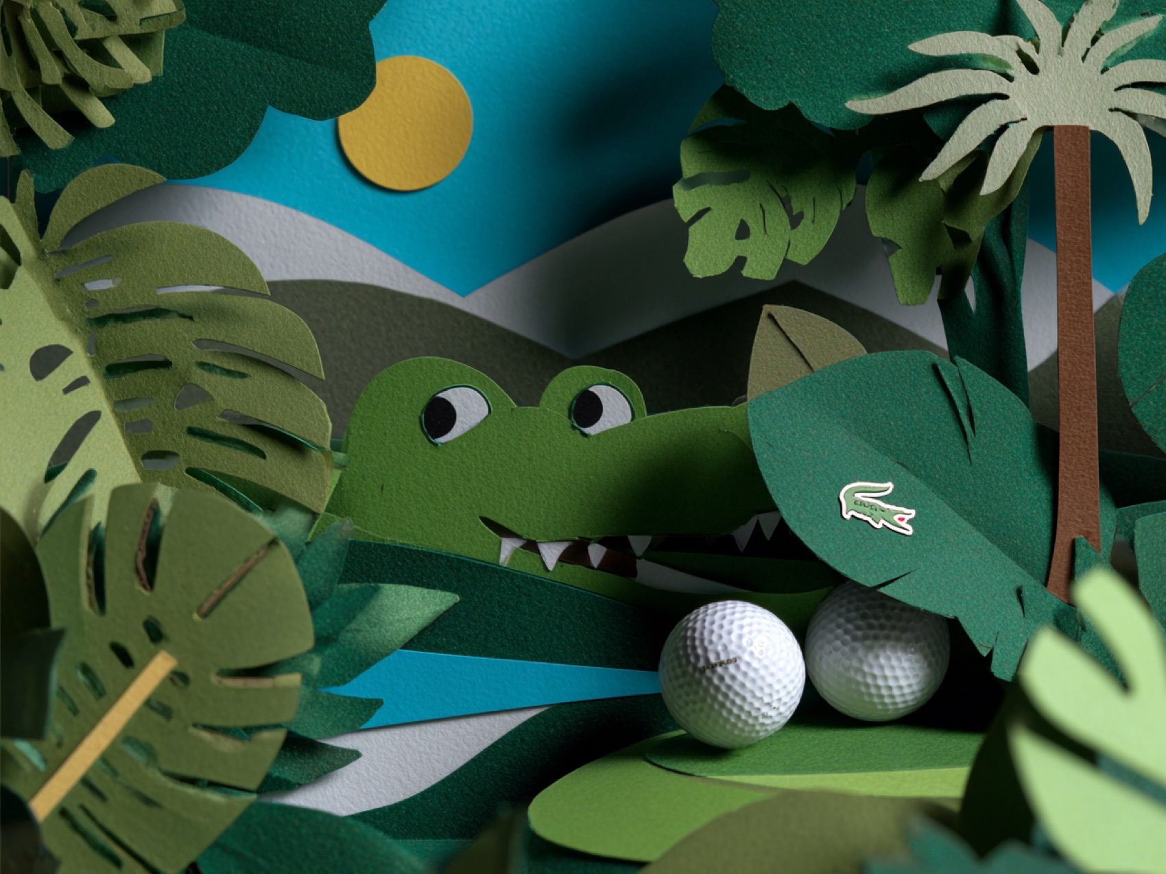 The crocodile lying low in paper undergrowth beside a ball