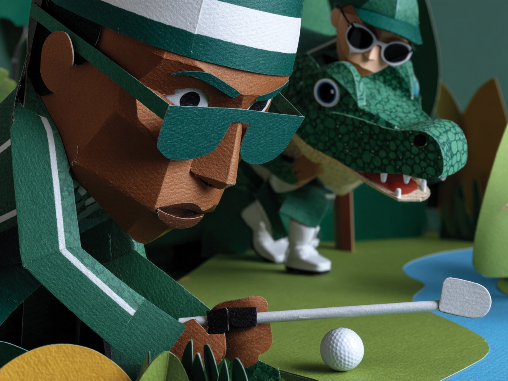 A paper player lining up a putt