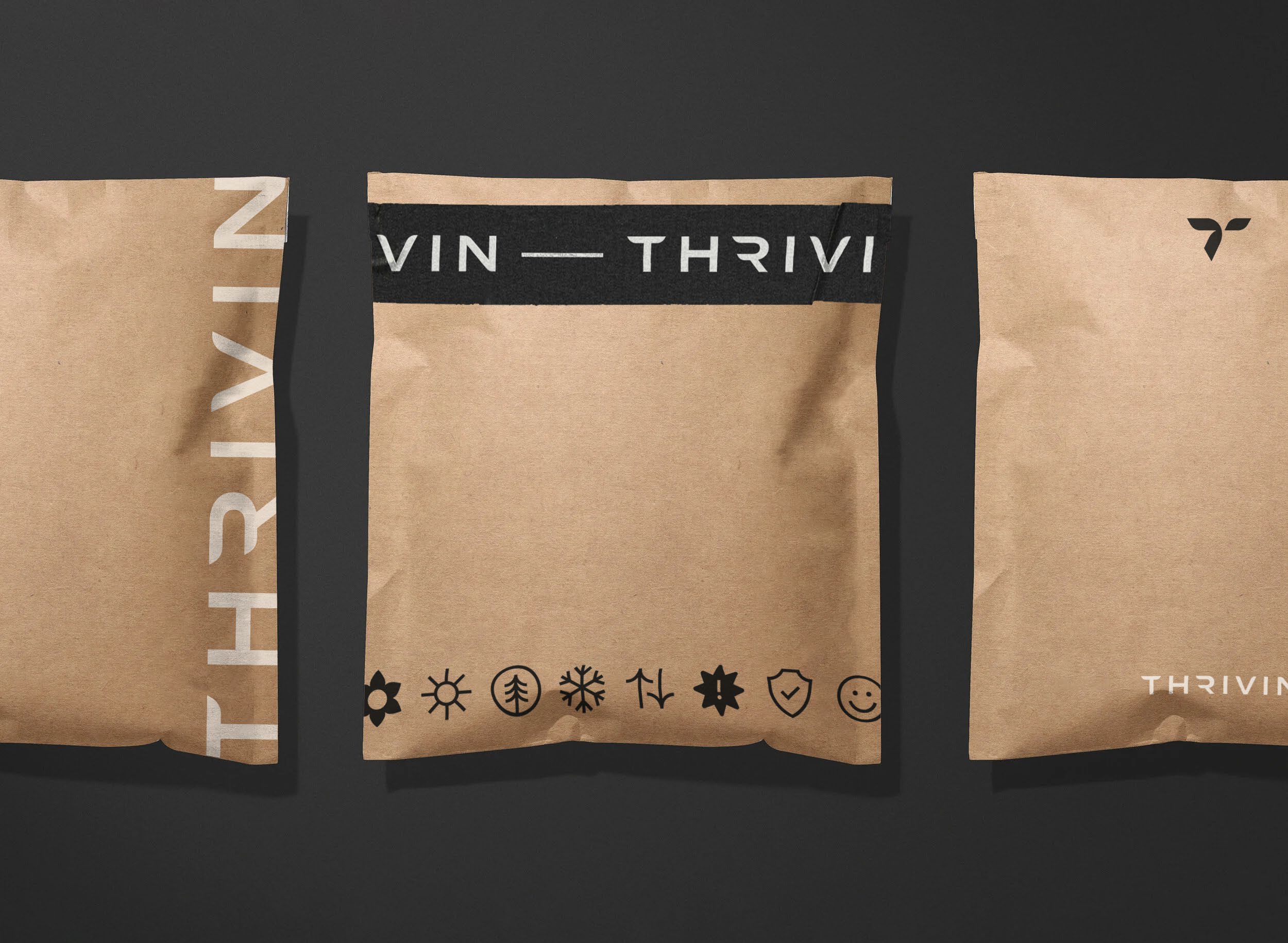 Thrivin kraft mailers carrying the wordmark, mark and attribute icons