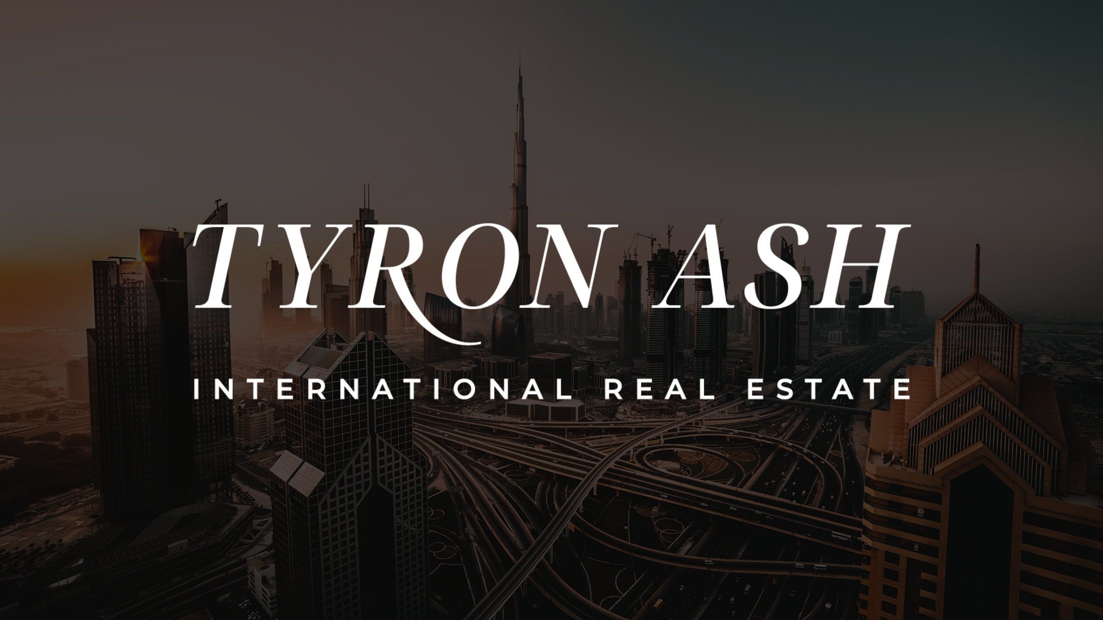 The wordmark over the Dubai skyline at dusk