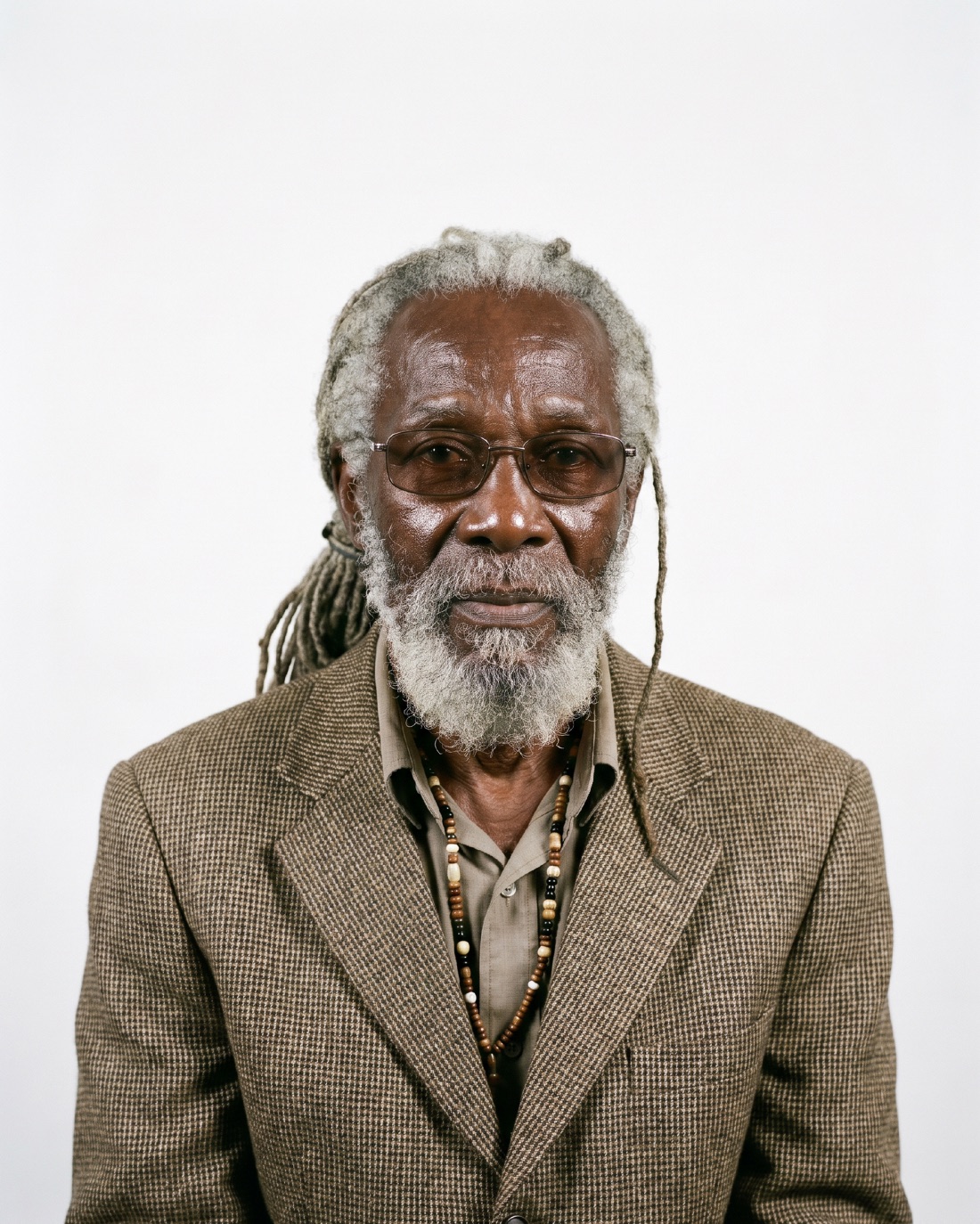 Casting portrait: greying locs and beard